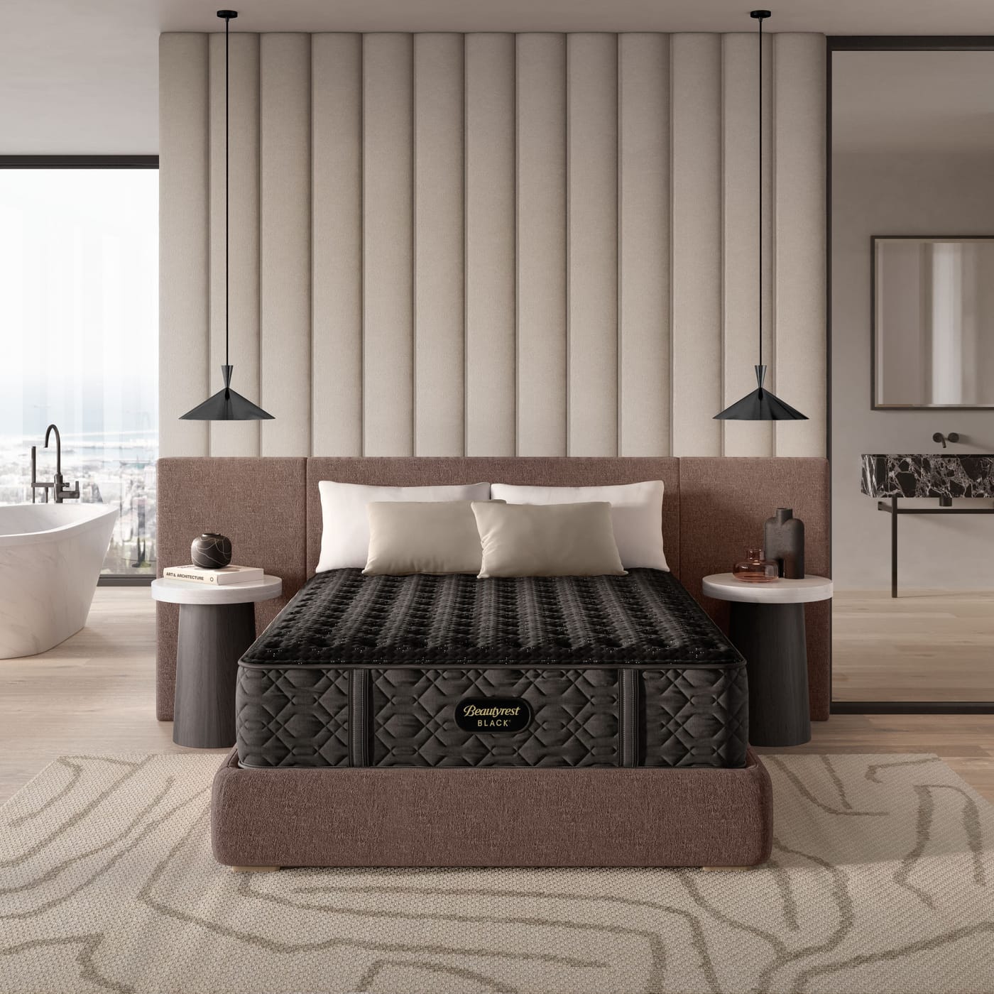 A Beautyrest Black mattress made up on an upholstered base in a penthouse bedroom