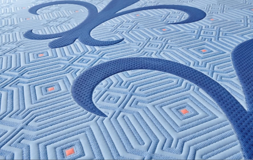 Close-up of the quilted fleur-de-lis panel on a Stearns and Foster mattress